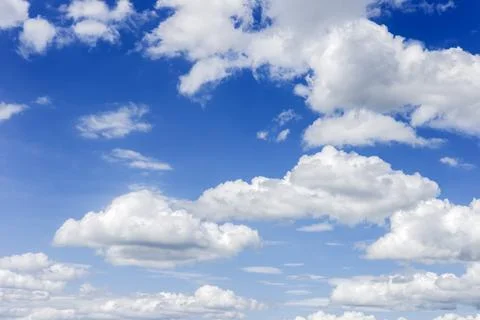 Clear blue sky with plain white cloud with space for text background. The v.. Stock Photos