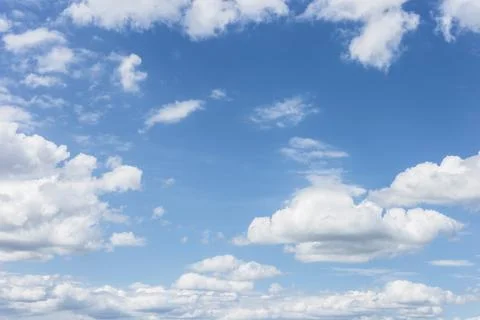Clear blue sky with plain white cloud with space for text background. The v.. Stock Photos