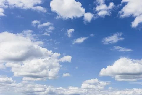 Clear blue sky with plain white cloud with space for text background. The v.. Stock Photos