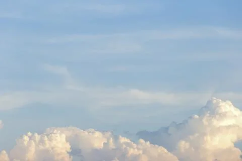 Clear blue sky with plain white cloud with space for text background. The v.. Stock Photos