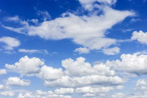 Clear blue sky with plain white cloud with space for text background. The v.. Stock Photos