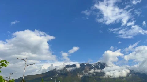 Clear blue sky with scattered fluffy clouds and open atmosphere Stock Footage 310246935