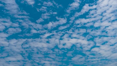 Clear Blue Sky With Scattered White Clouds Moving Slowly In The Atmosphere Video stock 342226156
