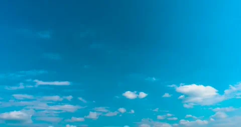 Clear Blue Sky With Scattered White Fluffy Clouds During A Sunny Day Stock Footage 342228831