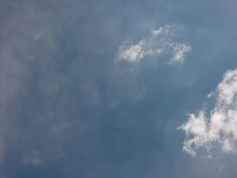 Clear blue sky with small white clouds 스톡 사진