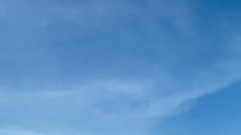 Clear Blue Sky with Soft Clouds Stock Footage 325193474