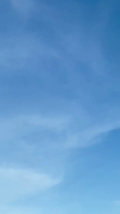 Clear Blue Sky with Soft Clouds Stock Footage 325193479