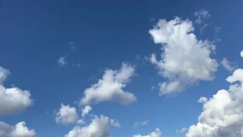 Clear blue sky with soft fluffy white clouds Stock Footage 226411934