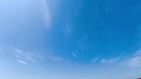 Clear Blue Sky with Soft White Cirrus Clouds Moving Slowly in Bright Daylight Stock Footage 341803719