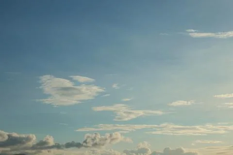 Clear Blue Sky With Soft White Clouds Stockfoto's