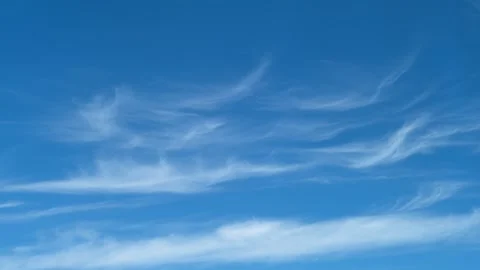 Clear blue sky with thin cirrus clouds. Natural atmospheric background with soft Stock Footage 341857622