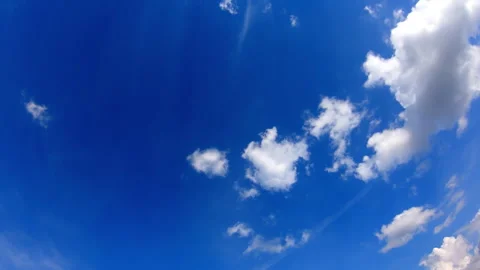 A clear blue sky with thin, wispy white clouds scattered across the frame. Video stock 283855187