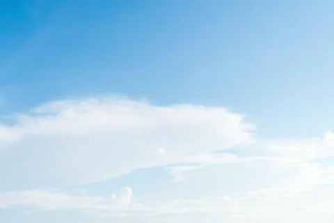 Clear blue sky with white cloud background. Clearing day and Good weather in Stock Photos