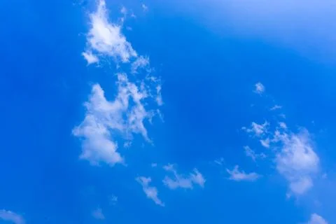 Clear blue sky with white cloud background in the morning. Good weather backg Stock Photos