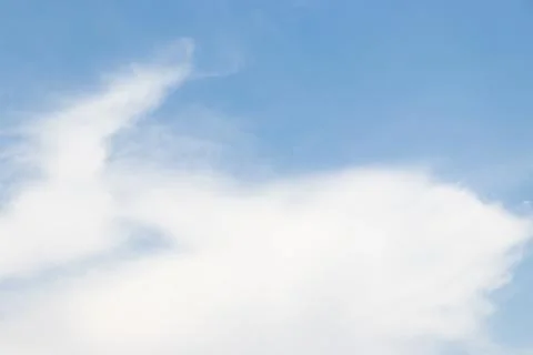 Clear blue sky with white cloud background Foto stock