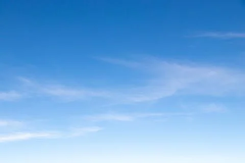 Clear blue sky with white cloud background Stock Photos