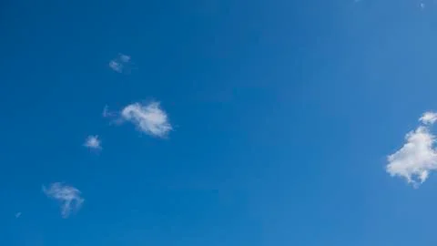 Clear blue sky with white clouds on a clear day Stock Photos