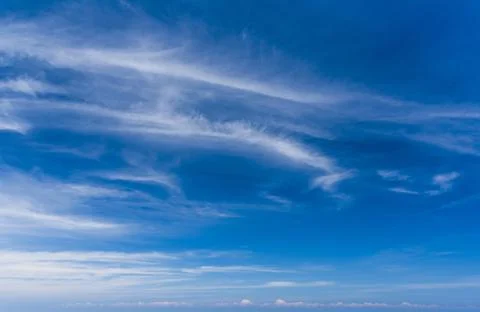 Clear blue sky with white clouds Stock Photos