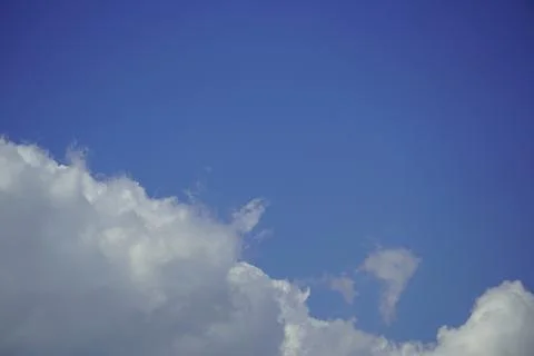 A clear blue sky with white clouds 写真素材
