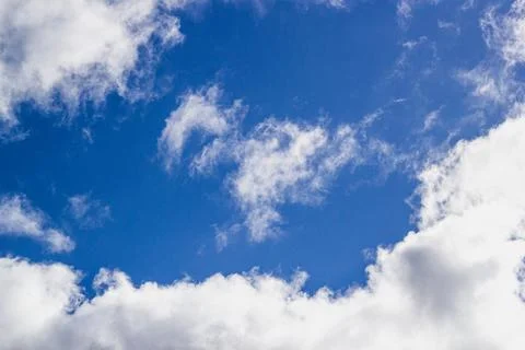 Of a clear blue sky with white clouds. Stock Photos