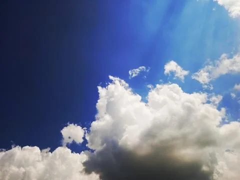 Clear blue sky with white clouds Stock Photos
