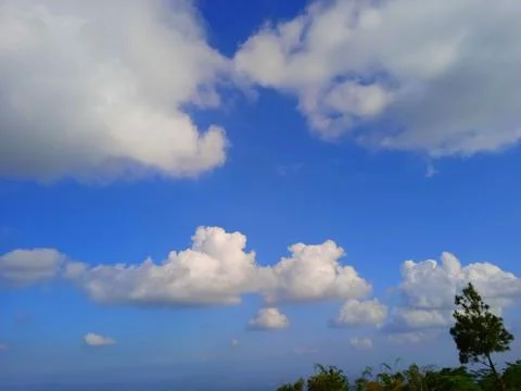 Clear blue sky with white clouds Stock Photos