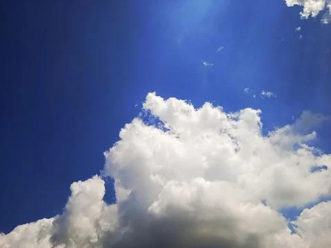 Clear blue sky with white clouds Stock Photos
