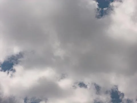 Clear blue sky with a wispy cloud Stock Photos