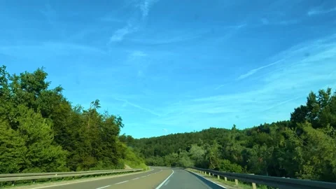 Clear blue sky with wispy clouds above road. Mount Rtanj Area, Serbia Stock Footage 340897429