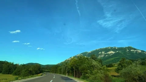 Clear blue sky with wispy clouds above green hills. Mount Rtanj Area, Serbia Stock Footage 340898498