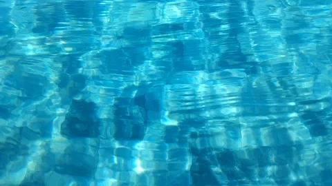 Clear blue swimming pool water ripples with tiled bottom background Stock-Footage 344453438