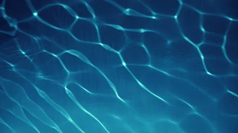 Clear Blue Transparent Water Reflecting The Sun With Slight Waves Stock Footage 65183632