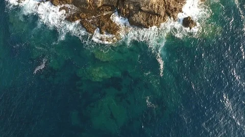 Clear blue water around Corsica seashore, aerial Stock Footage