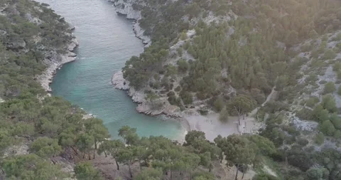 Clear blue water layer sandy beach cliff Calanques French Tourist Destination Stock Footage 185516616