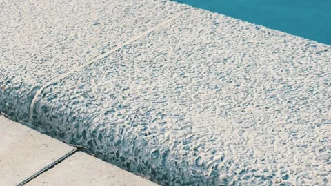 Clear blue water in the pool. Steps into the pool. The edge of the pool is finis Stock Footage 310264575