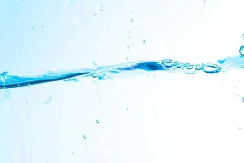 Clear blue water splash with bubbles in motion Stock Photos