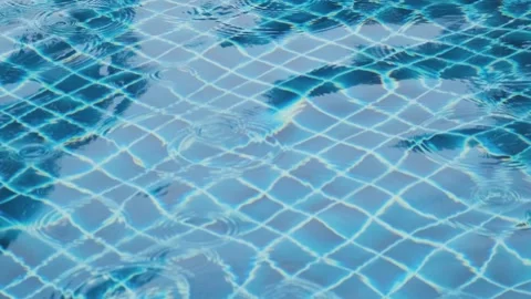 Clear blue water surface with ripples in swimming pool, creating abstract Stock Footage 288111551