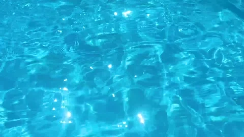Clear blue water surface rippling in swimming pool Stock Footage 330152706