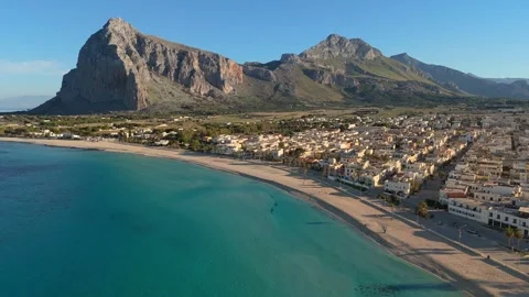 Clear blue water washes sandy beach of San Vito Lo Capo, Sicily, Italy 動画素材 341744460