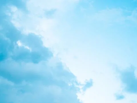 Clear Bright Blue Sky with Soft White Clouds on Sunny Day Stock Photos