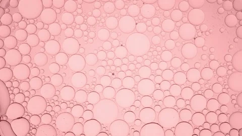 Clear bubble moves along smaller ones moving them and explodes Stock Footage 157657491