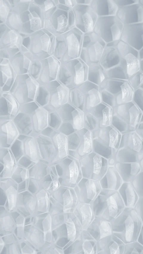 Clear bubble wrap with repeating translucent cells and soft highlights Stock Footage 344976101