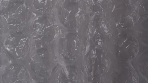 Clear bubble wrap texture with large air-filled pockets, showcasing its Stock Footage 290998523