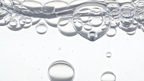 Clear Bubbles Form and Float to Another Ones on Transparent Surface on White Video stock 263726894