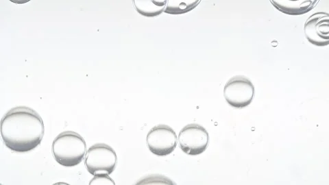 Clear Bubbles Form and Float to Another Ones on Transparent Surface on White Video stock 275956730