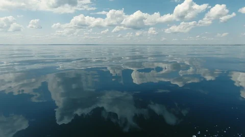 Clear calm sea and the reflection of clouds in the water-3 Stock Footage 113124778