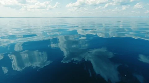 Clear calm sea and the reflection of clouds in the water-5 Stock Footage 113124800