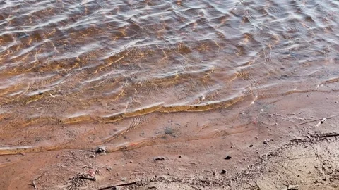 Clear, clean river water with small waves Stockbeeldmateriaal 329091243