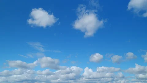 Clear cloudscape background. Cirrus and cumulus on different layers clouds in Stock Footage 216339477
