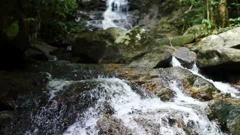 Clear cold waterfall flow into rock Video stock 95650246